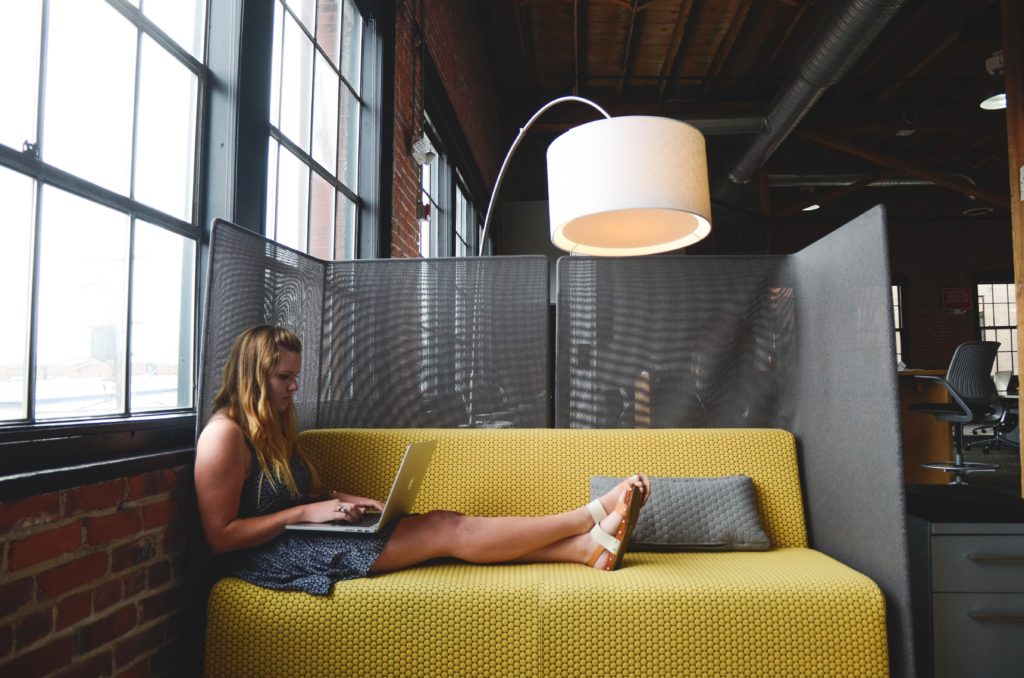 Gen Z woman working on a laptop